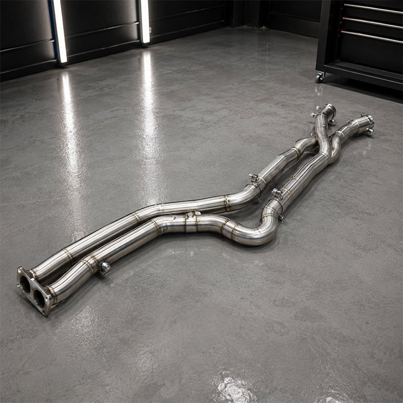 Stainless pipe on a garage floor under LED tube lights